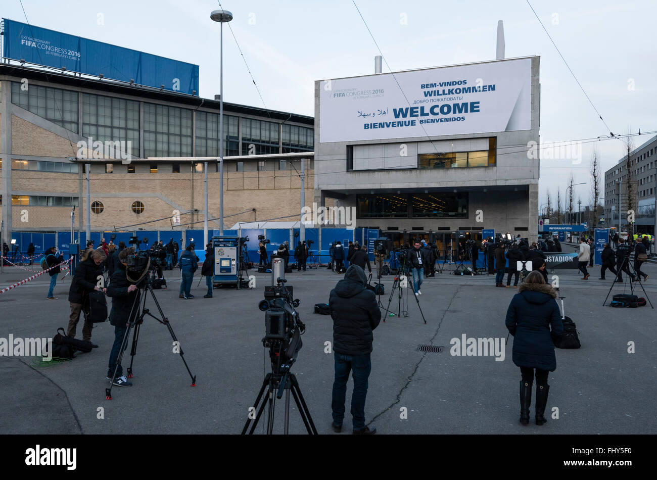 Zurich, Switzerland, 26th February, 2016: Media broadcasting teams from all over the world are waiting outside in the evening cold in front of Zurich's Hallenstadion, while the extraordinary FIFA congress 2016 takes place inside. After the FIFA congress approved extensive reforms, the election of the new FIFA president is expected to take until late evening. Credit:  Erik Tham/Alamy Live News Stock Photo