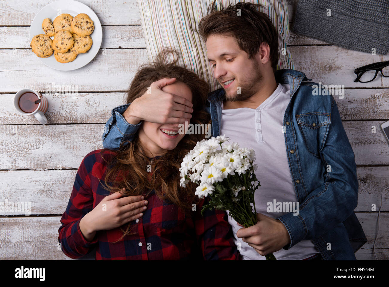 surprising girlfriend with flowers