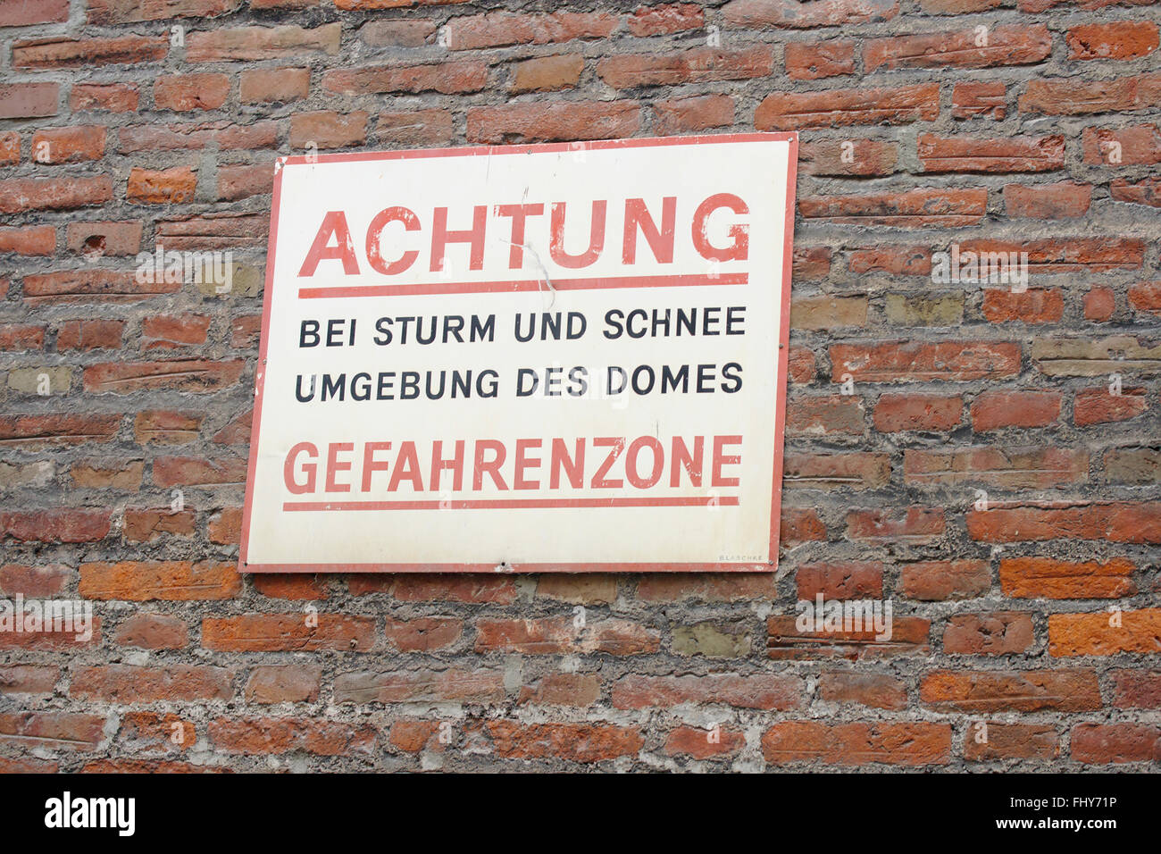 Sign 'Caution, in storm and snow danger zone around the cathedral' in Munich Stock Photo