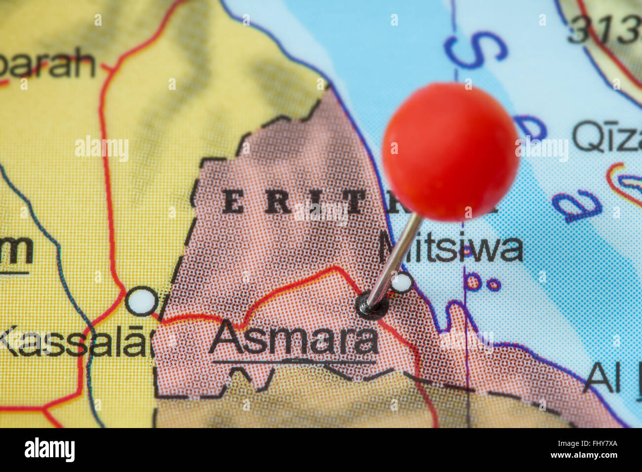 Close-up of a red pushpin in a map of Asmara (or Asmera), Eritrea. Stock Photo