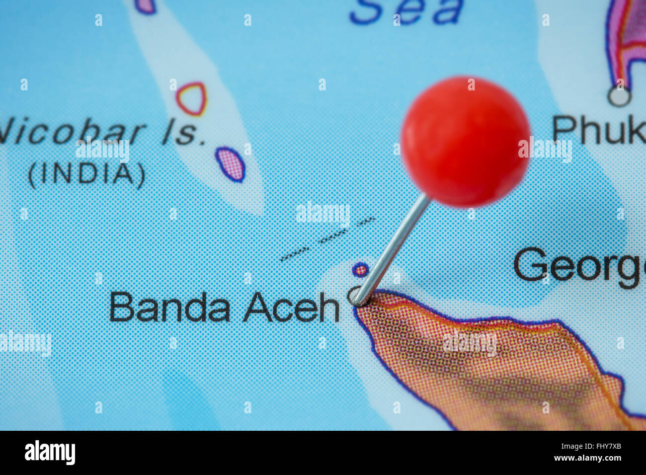 Close-up of a red pushpin in a map of Banda Aceh, Indonesia. Stock Photo