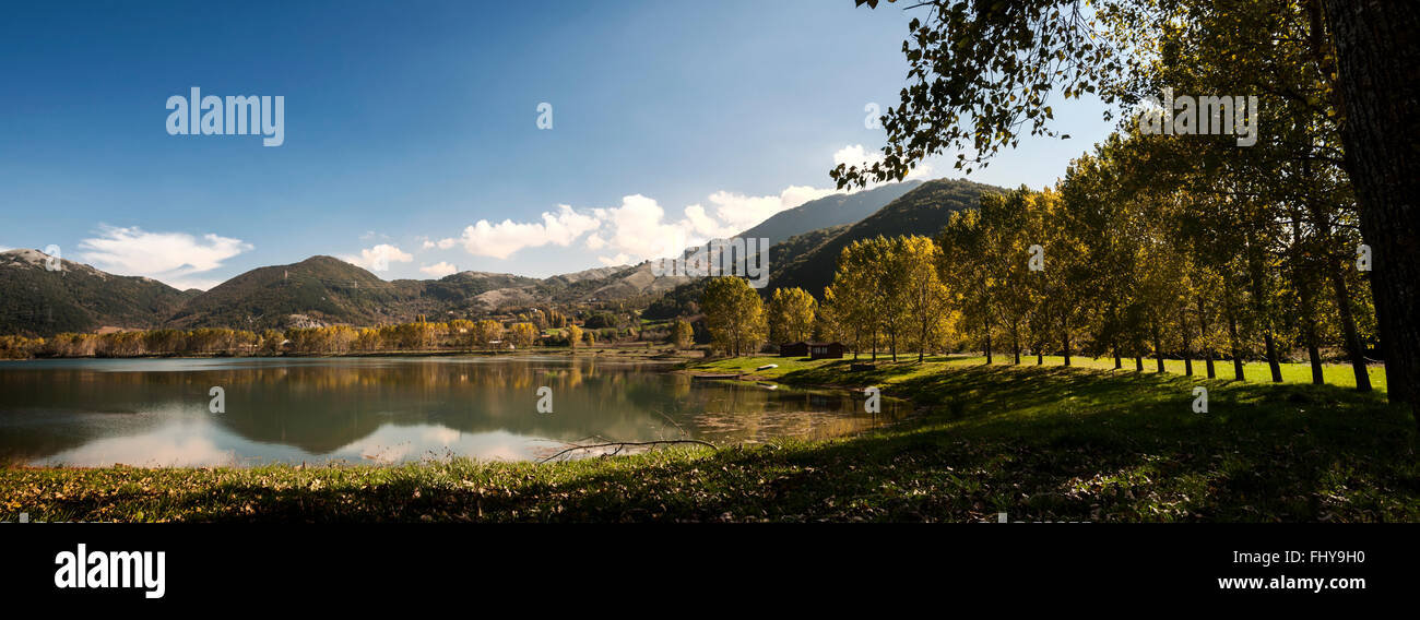 Lake with lots of trees around and mountain Stock Photo