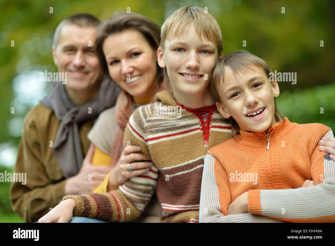 Happy family of four Stock Photo - Alamy