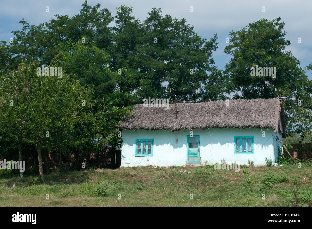 old wooden country houses in the fiels at Romania Stock Photo