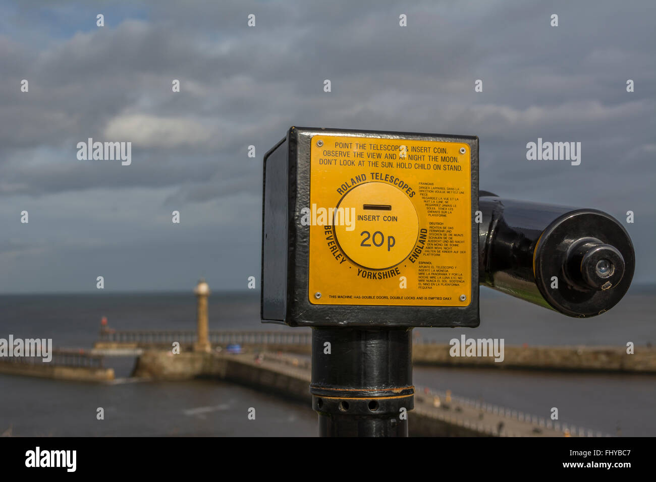 Coin operated telescope overlooking Whitby harbour. Stock Photo