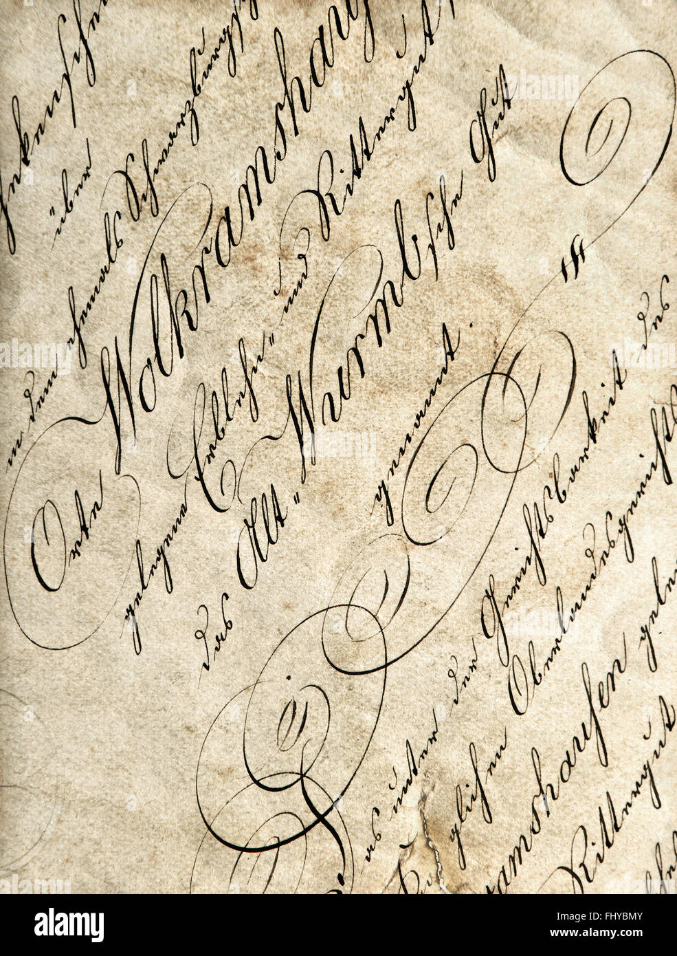 Antique calligraphy. Grungy worn paper texture Stock Photo