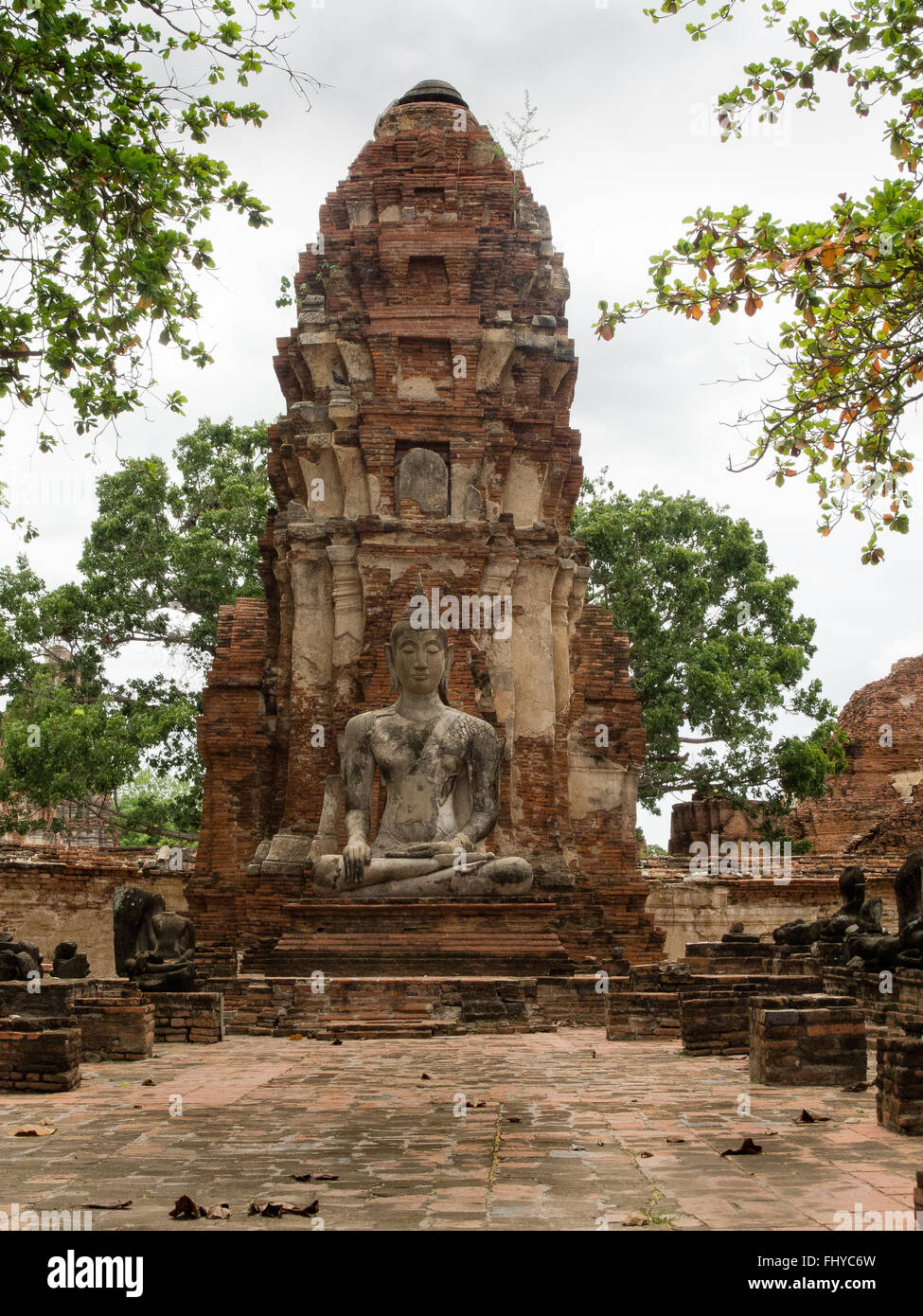 Temple buddha statue and ruins Wat Mahathat Ayutthaya Thailand Stock Photo