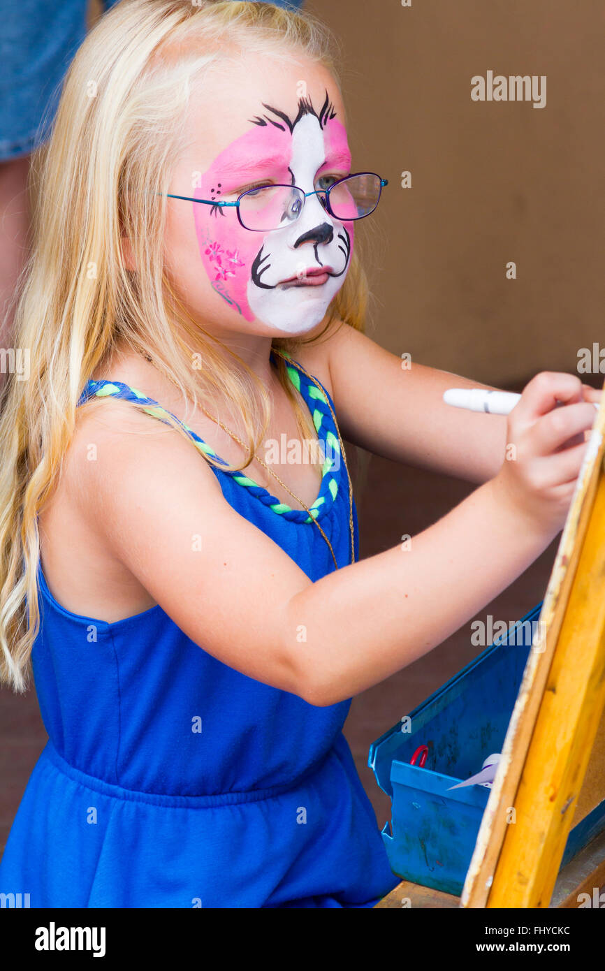 Santa Fe Indian Market  annual event  drawing for children, young girl with painted face Stock Photo