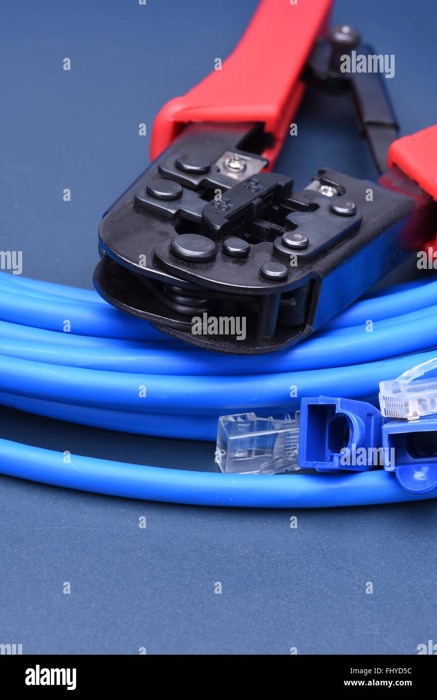 Crimping tool with cable for computer network Stock Photo - Alamy