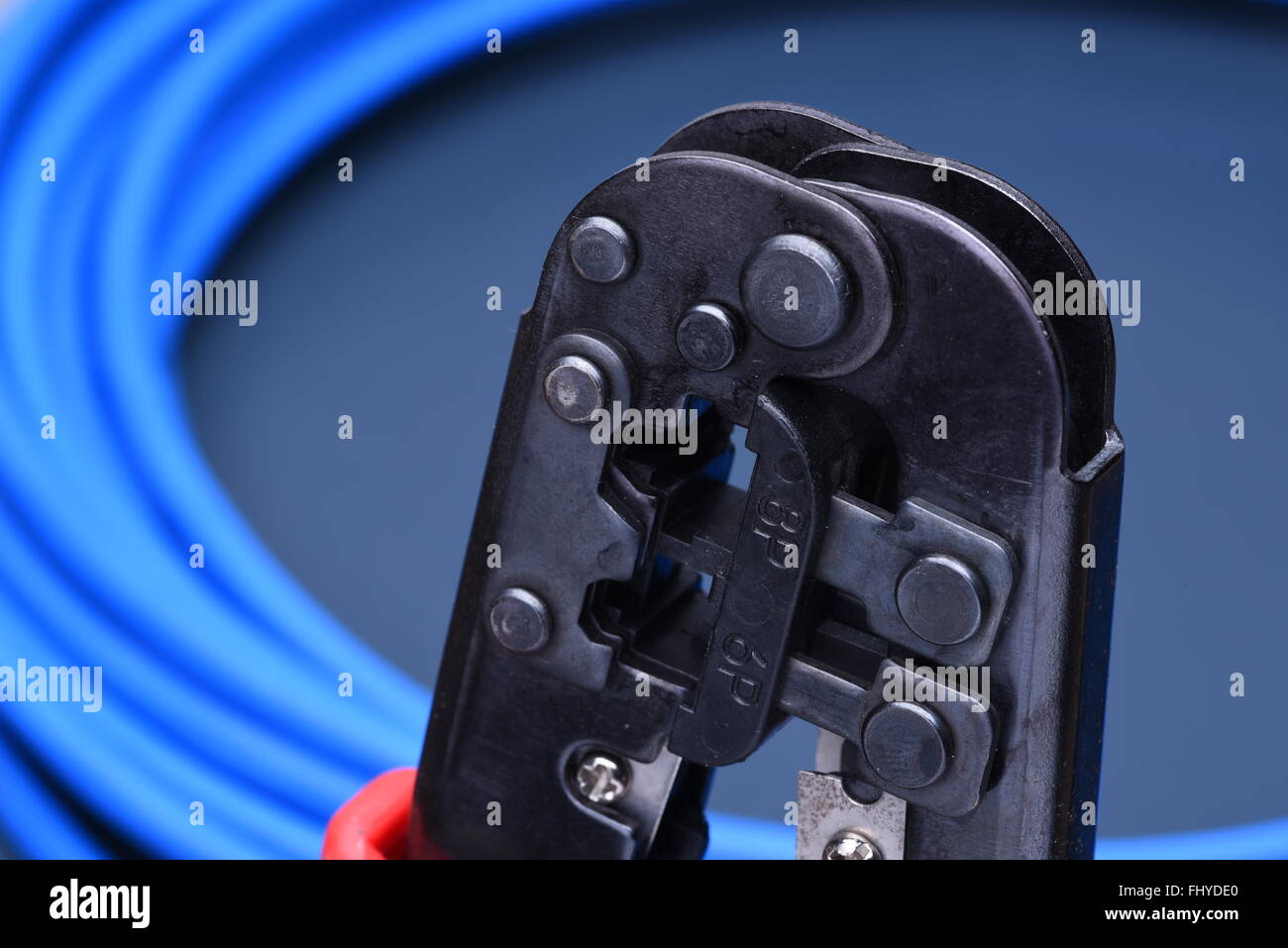 Crimping tool with cable for computer network Stock Photo - Alamy