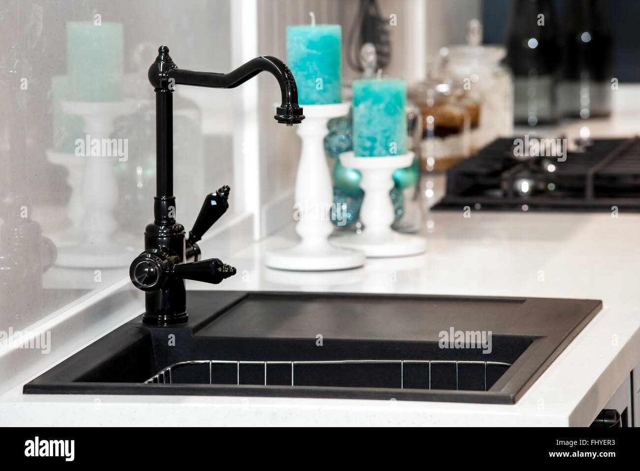 Modern black kitchen sink and faucet Stock Photo Alamy