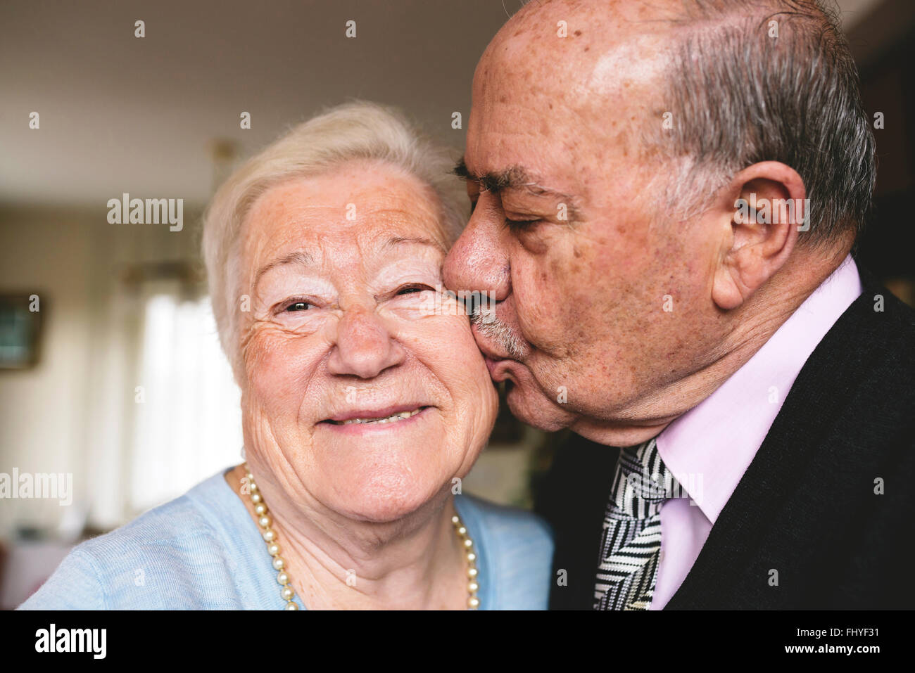 Old woman and young man kissing hi-res stock photography and images - Alamy