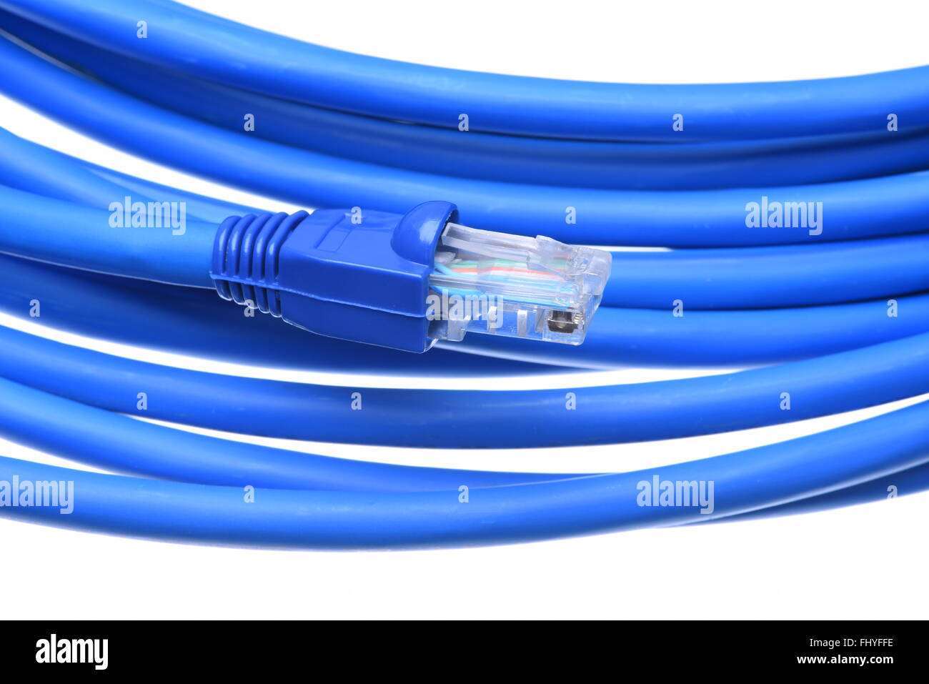 Blue computer network cable with plug isolated on white background Stock Photo