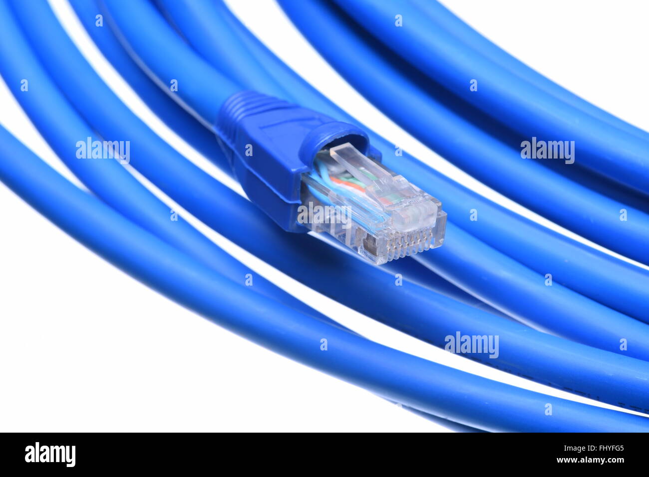 Blue computer network cable with plug isolated on white background Stock Photo