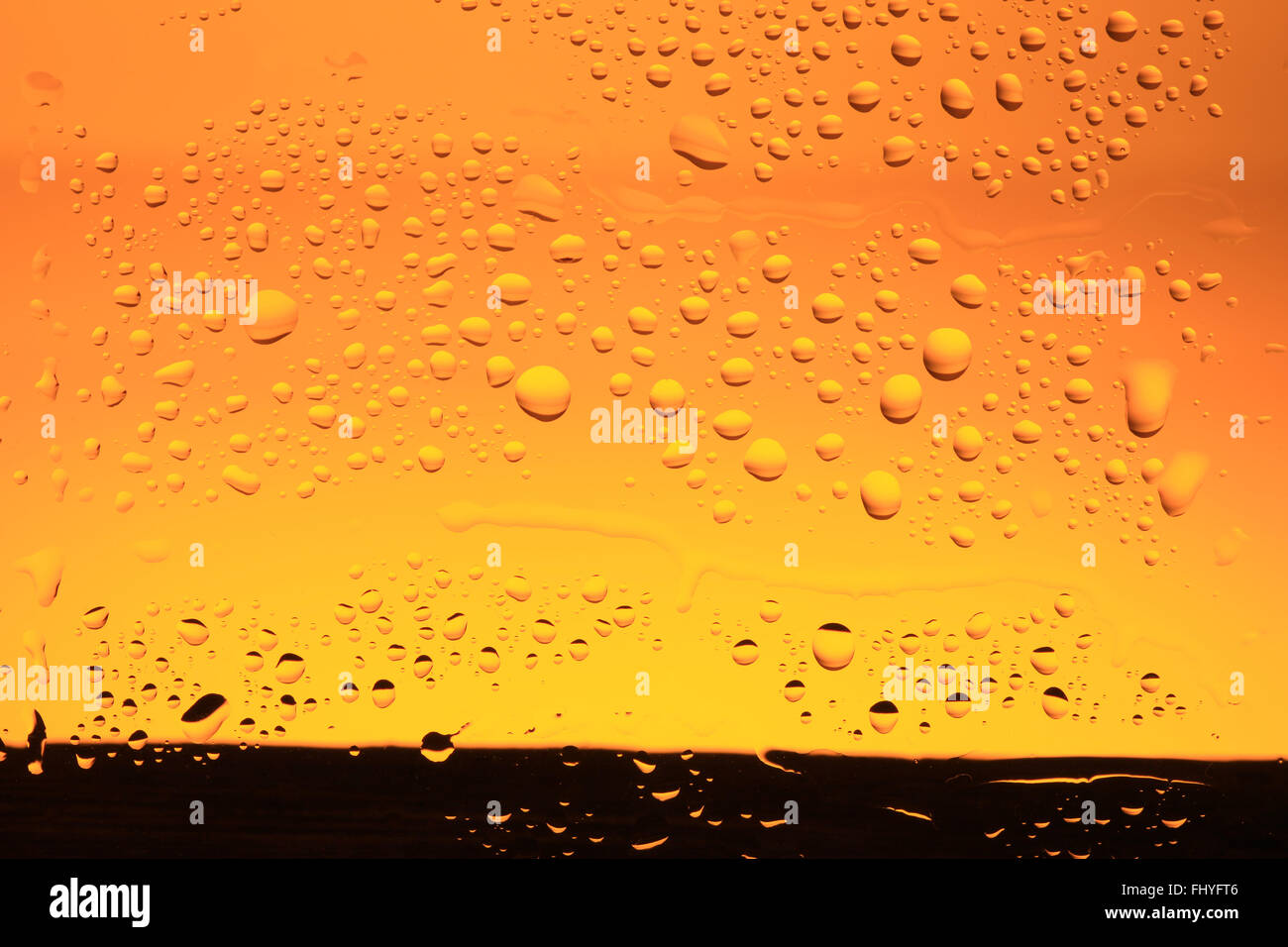 abstract yellow background with water drops Stock Photo - Alamy
