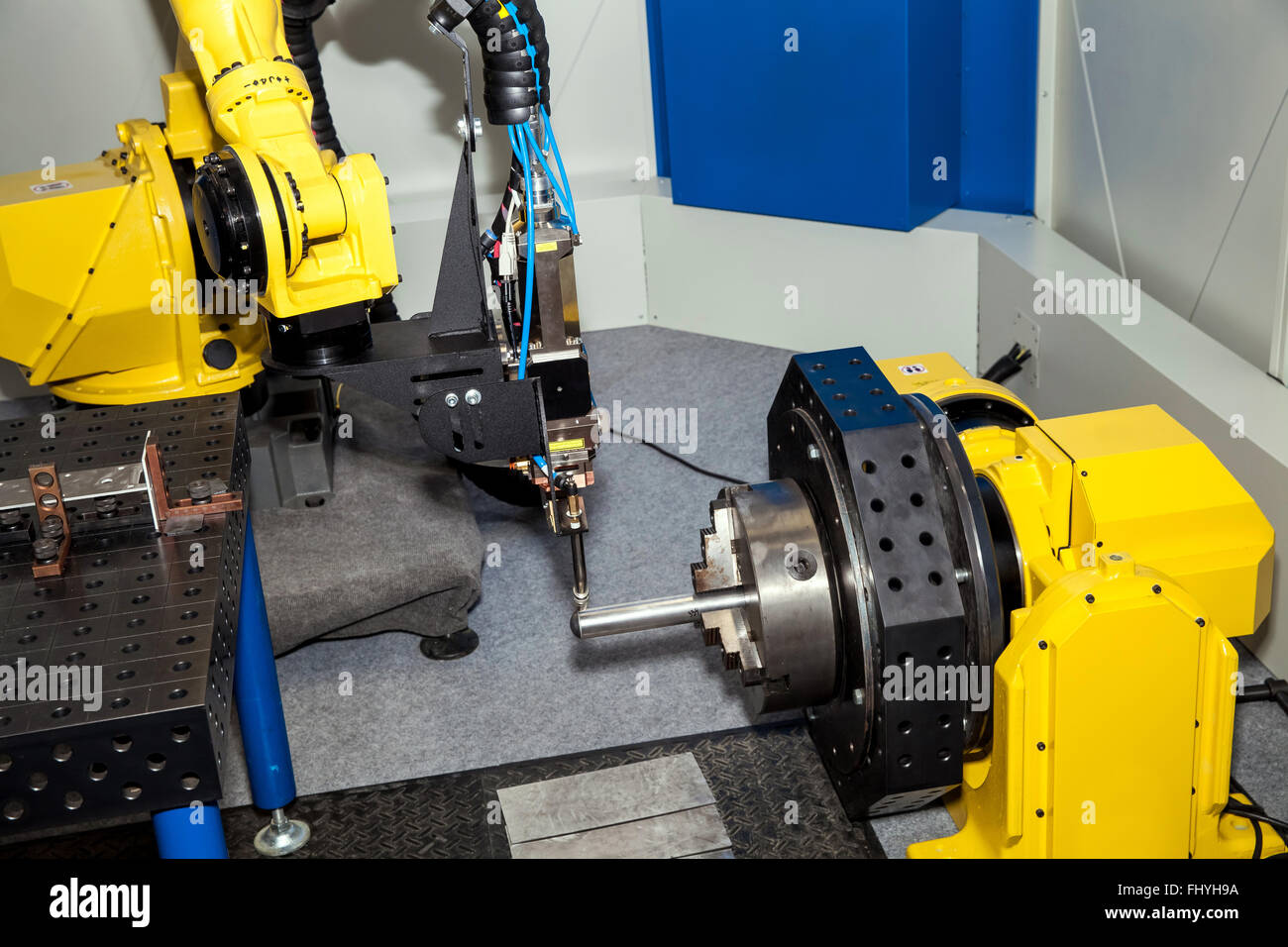 Industrial robot metal processing Stock Photo