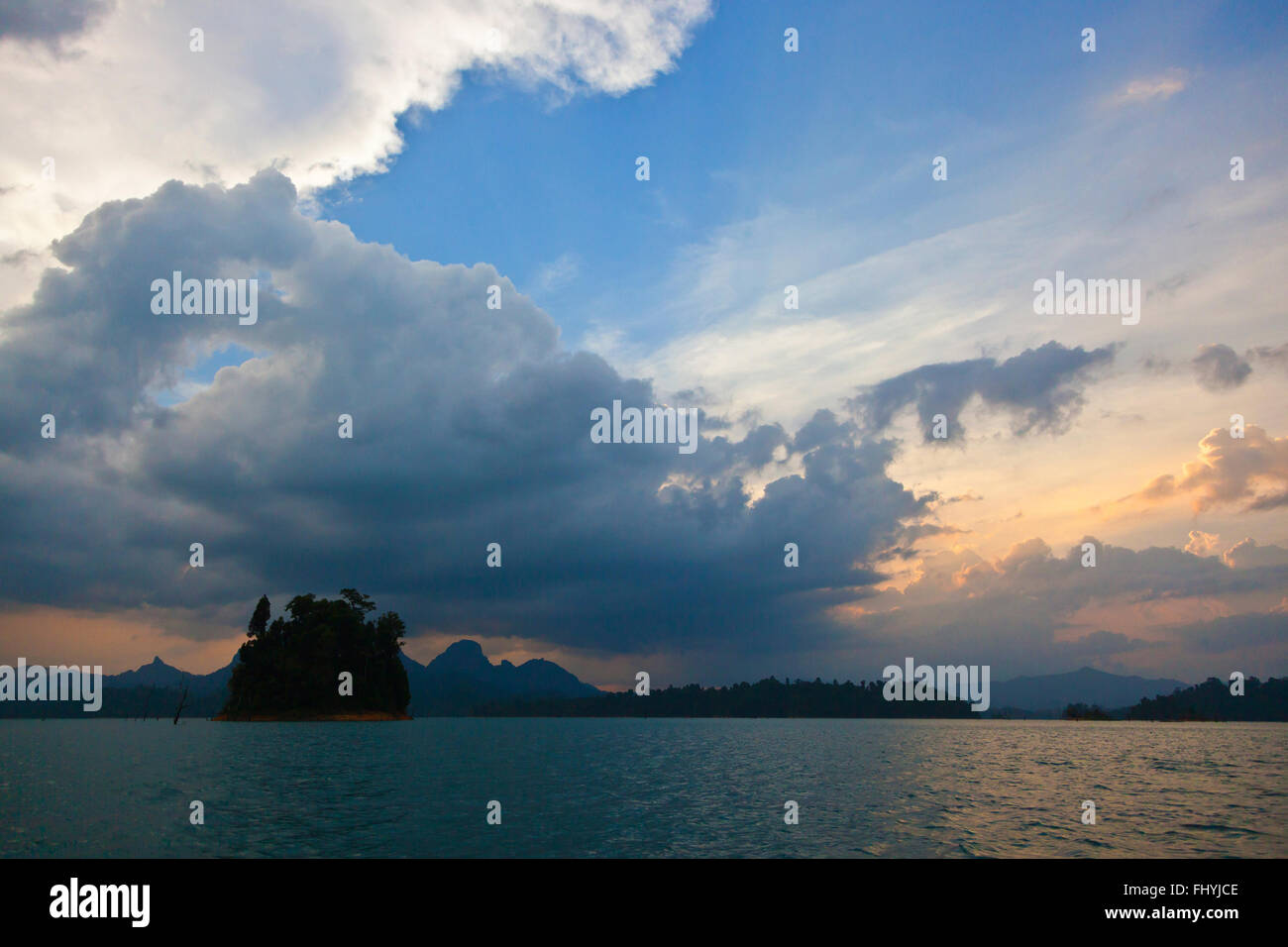 Sunset and storm clouds on CHEOW EN LAKE in KHAO SOK NATIONAL PARK - THAILAND Stock Photo