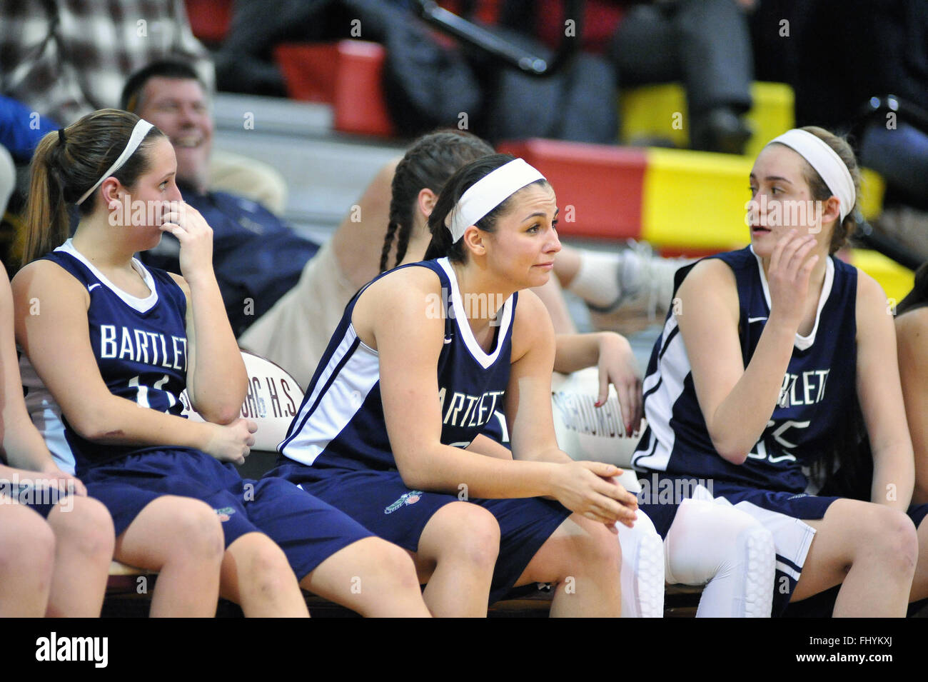 High school senior teammates tear up on the bench with emotion during the final seconds of a playoff game as defeat looms. USA. Stock Photo