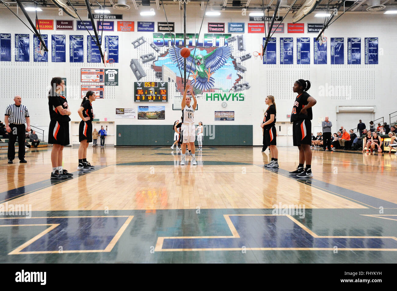 Late in the game a high school player making free throws to add to her team's lead and lock down a victory. USA. Stock Photo