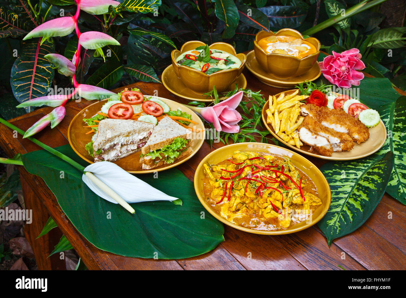 Delicious FOOD is served anytime at the RIVERSIDE COTTAGES in KHO SOK, a perfect place to stay to visit Kho Sok National Park - Stock Photo