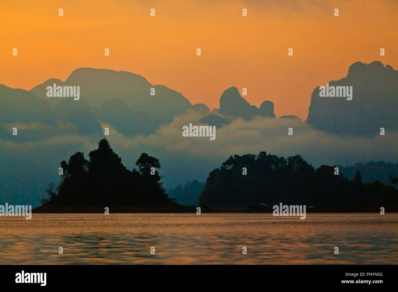 SUNSET on KLONG SAENG of CHEOW EN LAKE in KHAO SOK NATIONAL PARK - THAILAND Stock Photo