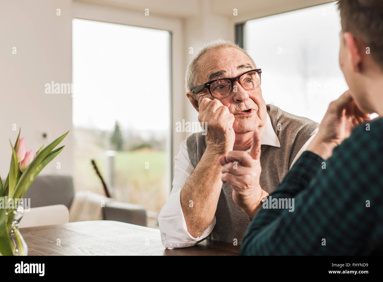 Portrait of senior man communicating with his grandson Stock Photo
