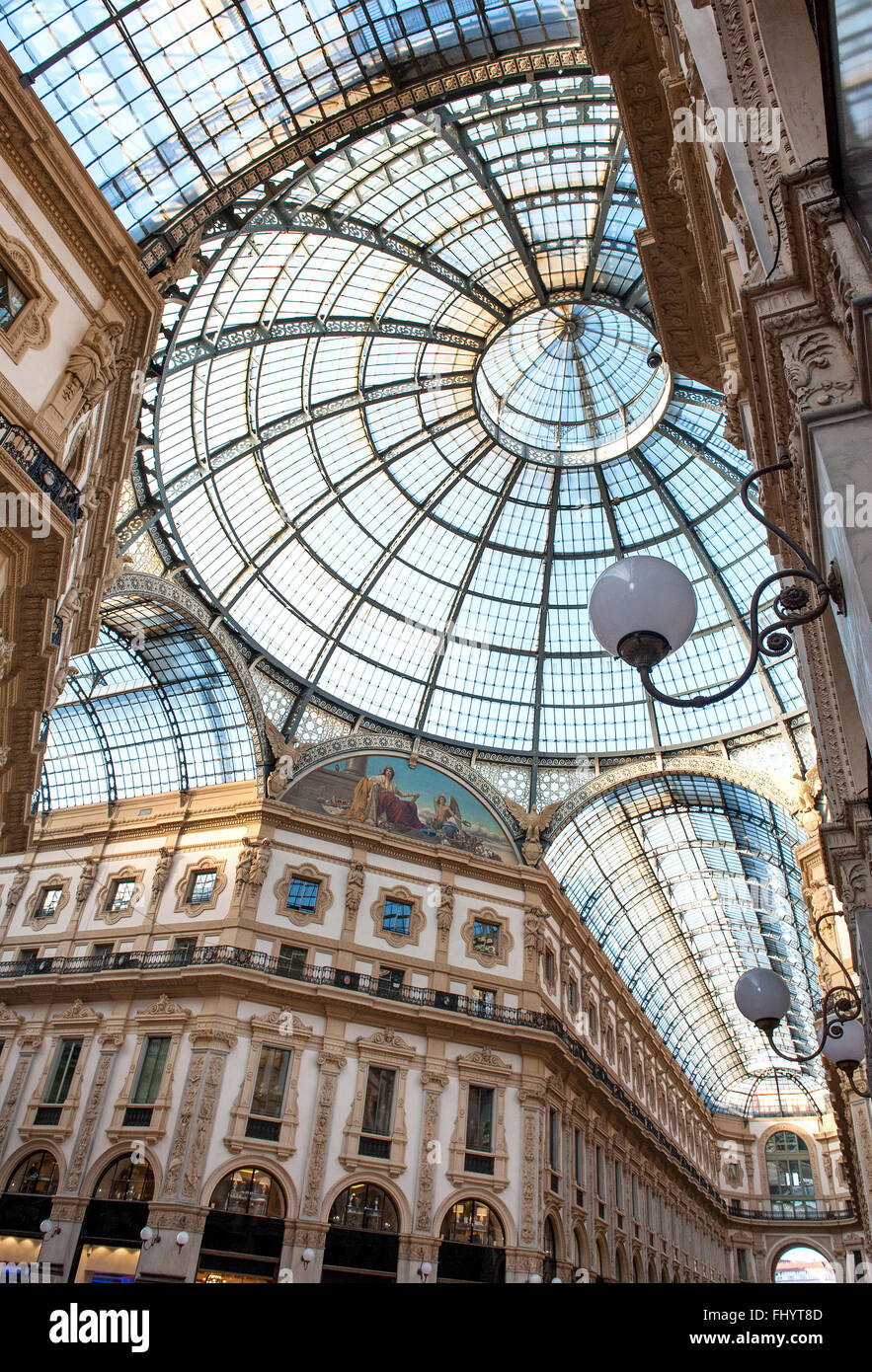 Low angle view of corridors and circular domed ceiling and windows inside the Vittorio Emanuele Milan shopping mall interior Stock Photo
