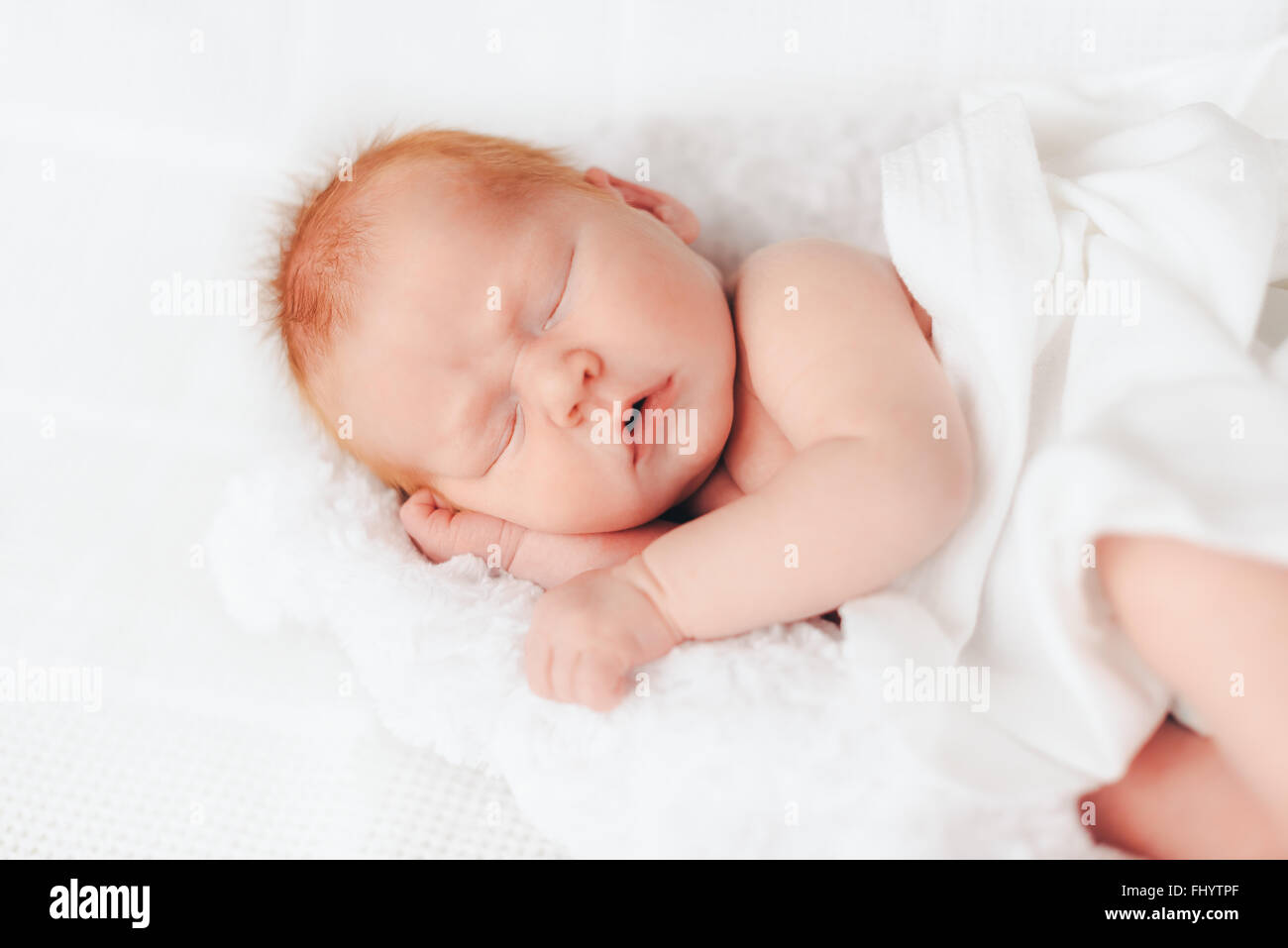 sleeping newborn baby in a wrap Stock Photo Alamy