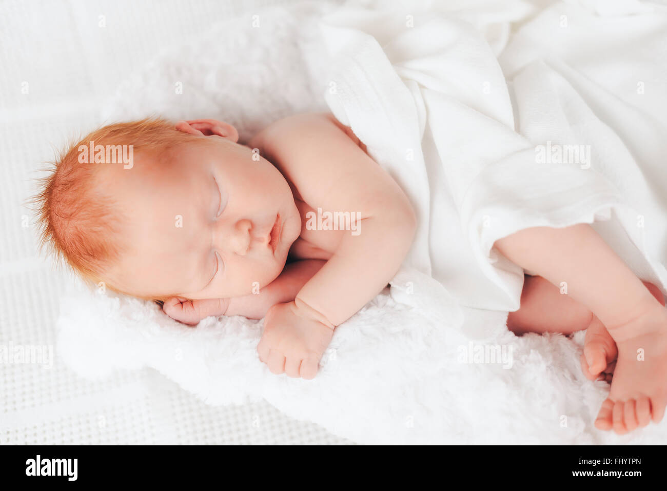 sleeping newborn baby in a wrap Stock Photo Alamy
