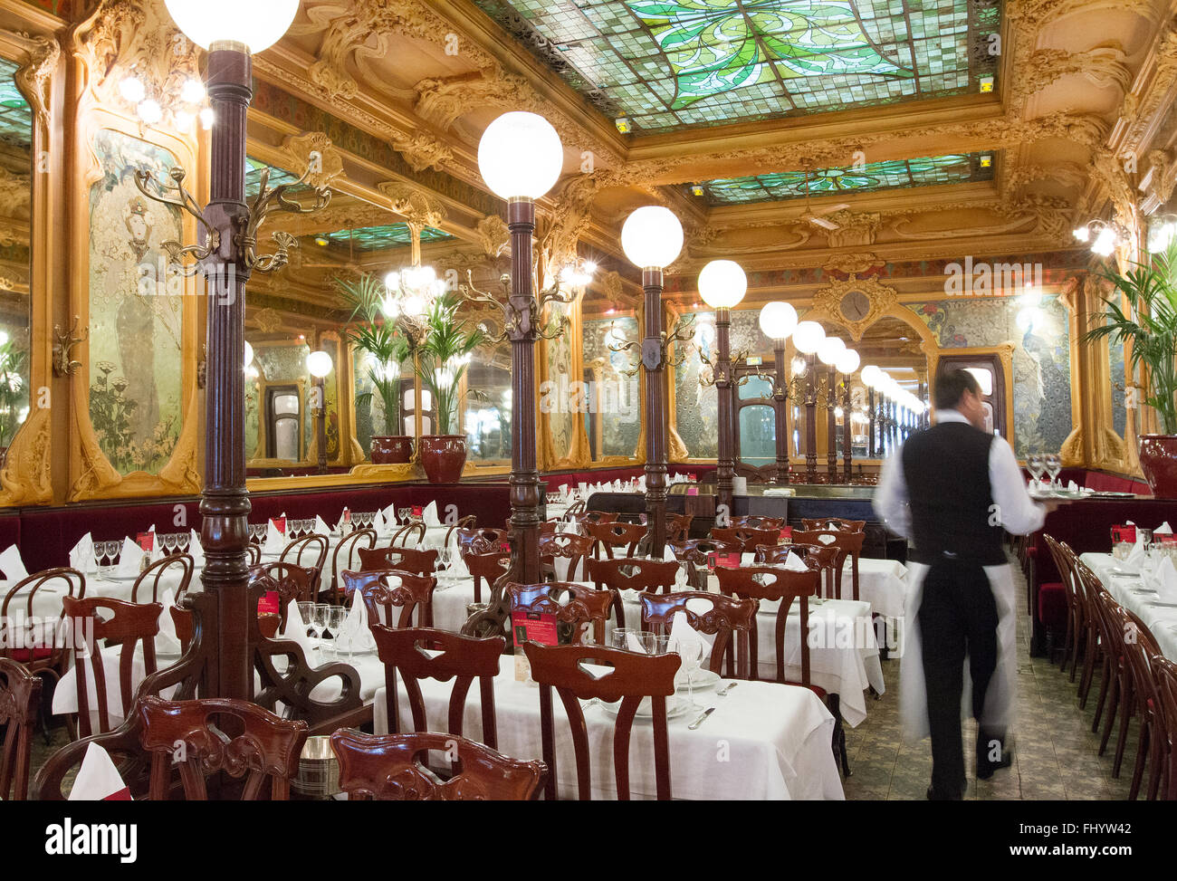 French waiter at the historic Julien Art Nouvea style restaurant  Paris France Stock Photo