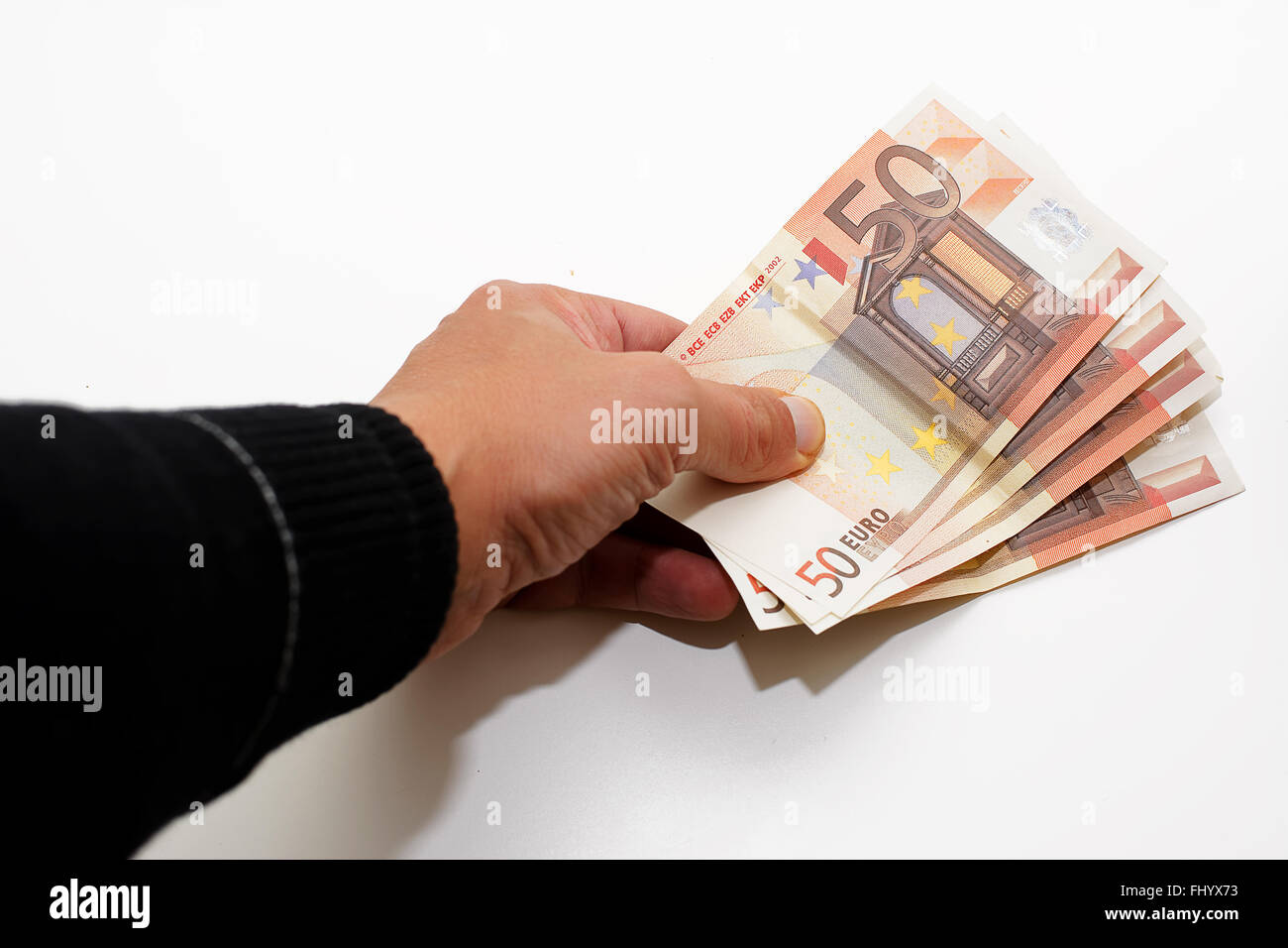 Hand that pay with currency Stock Photo