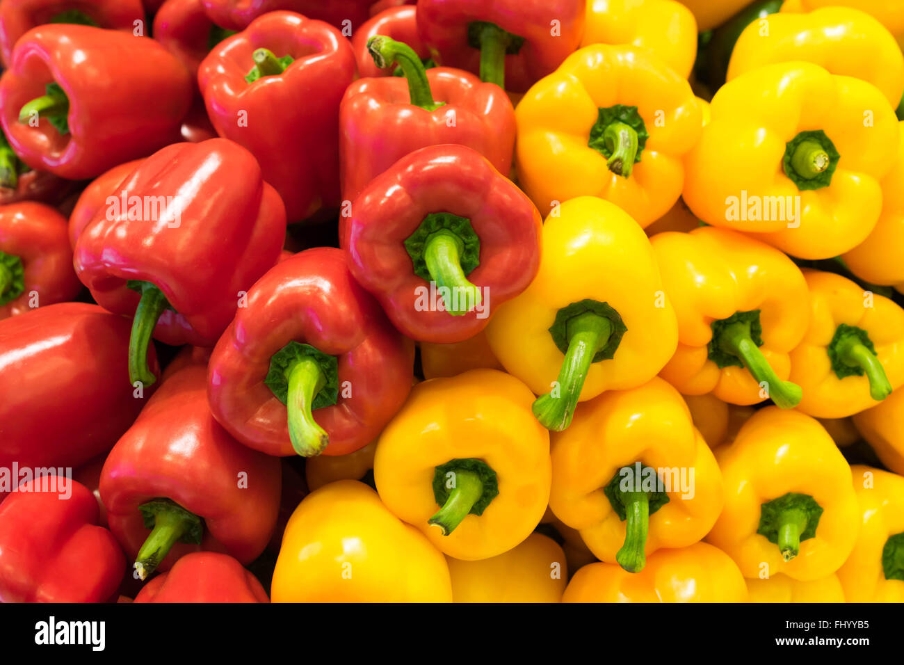 Red and yellow bell peppers (capsicum) background Stock Photo