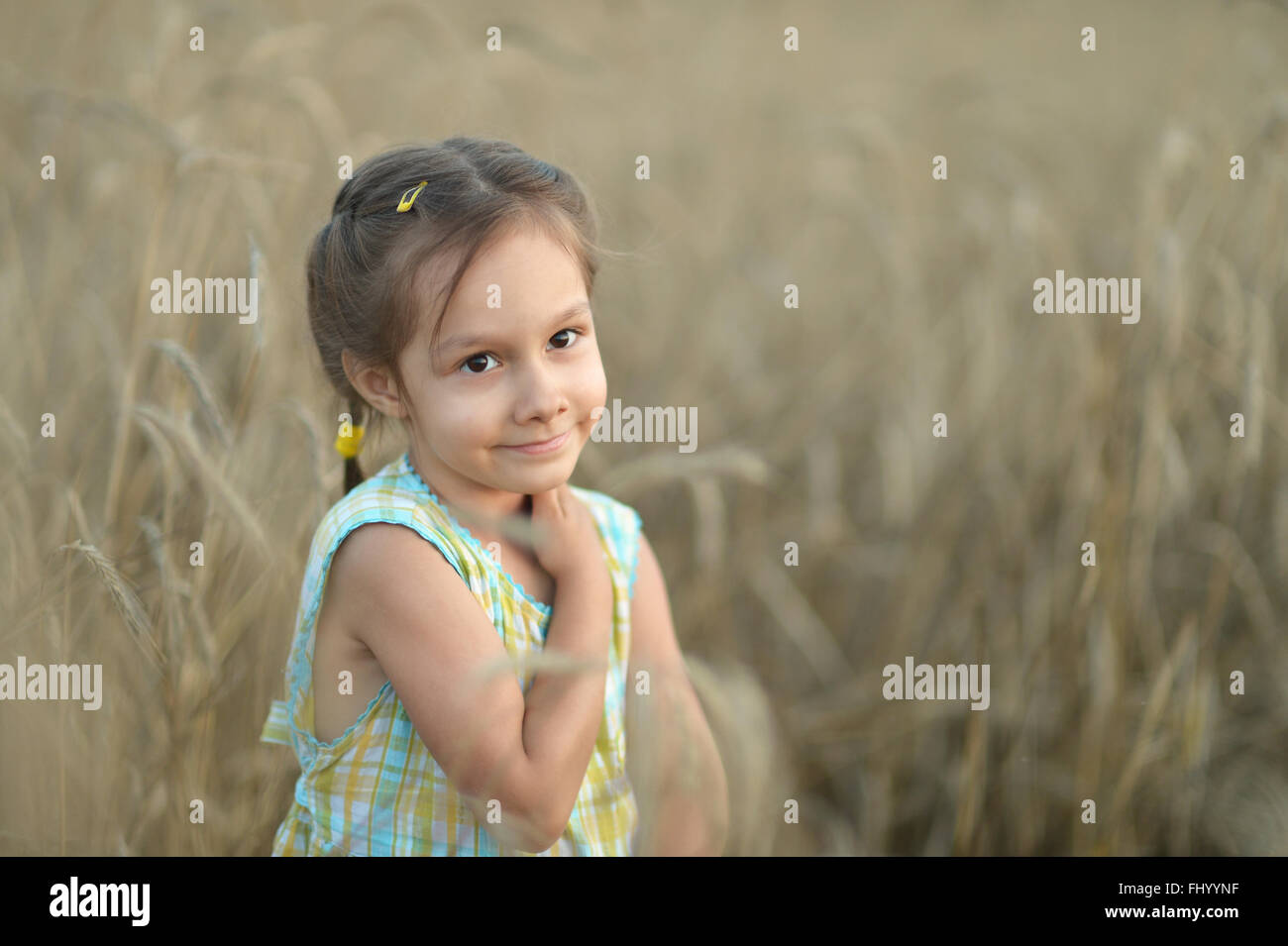 Cute girl in field Stock Photo - Alamy