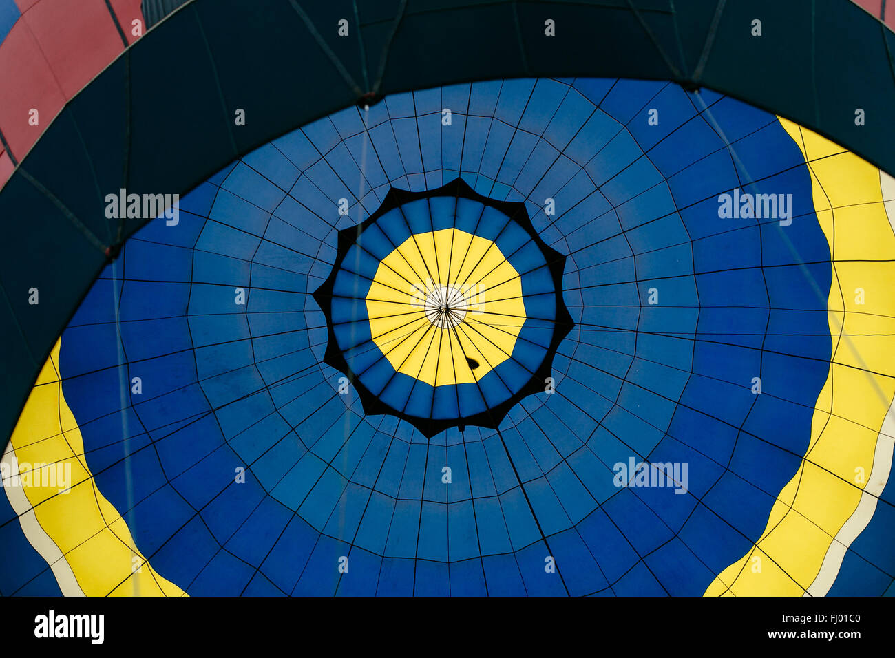 Inside the blue and yellow air balloon with stripes Stock Photo
