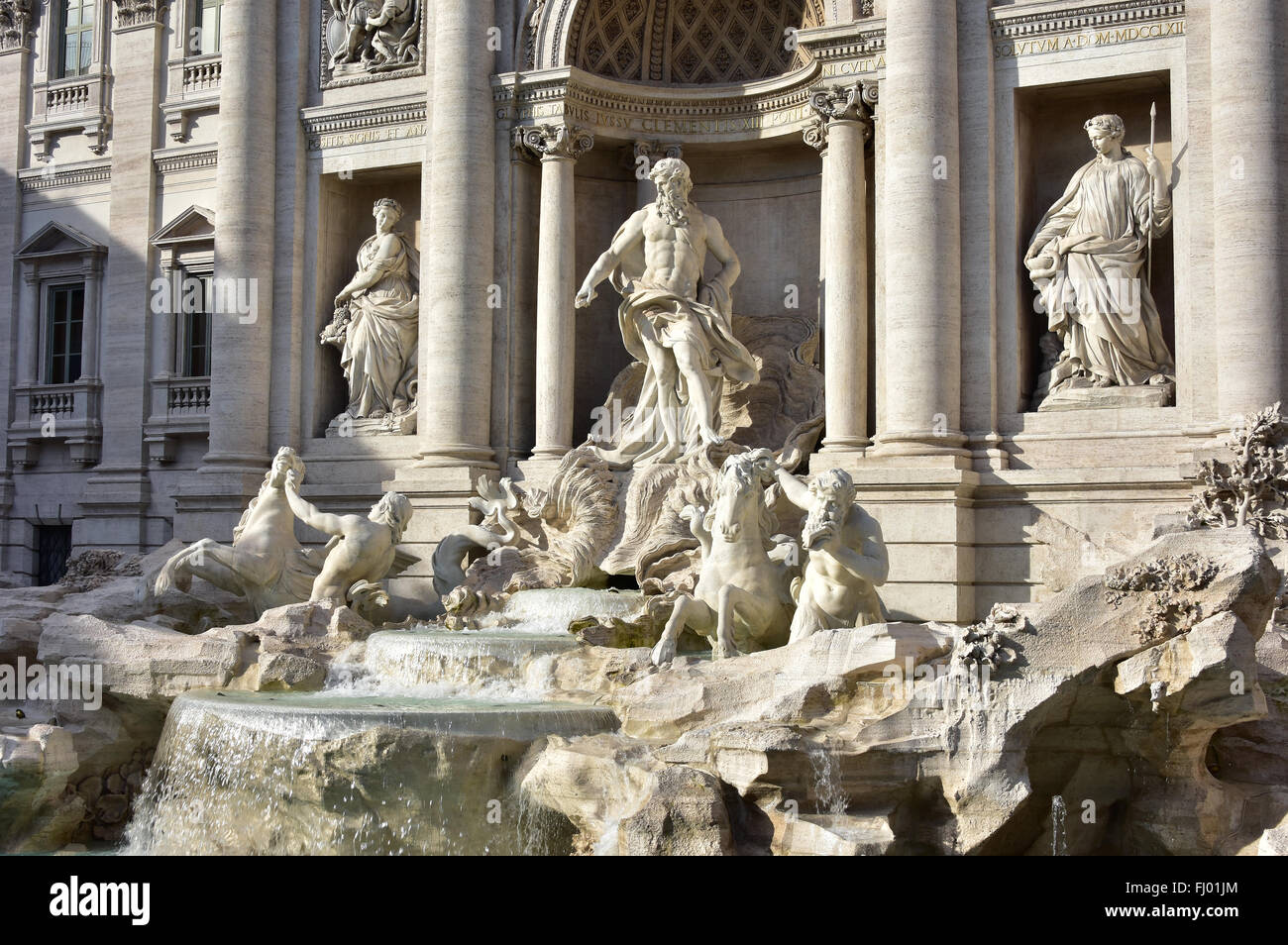 Beautiful baroque Trevi Fountain with ocean deities marble statues Stock Photo