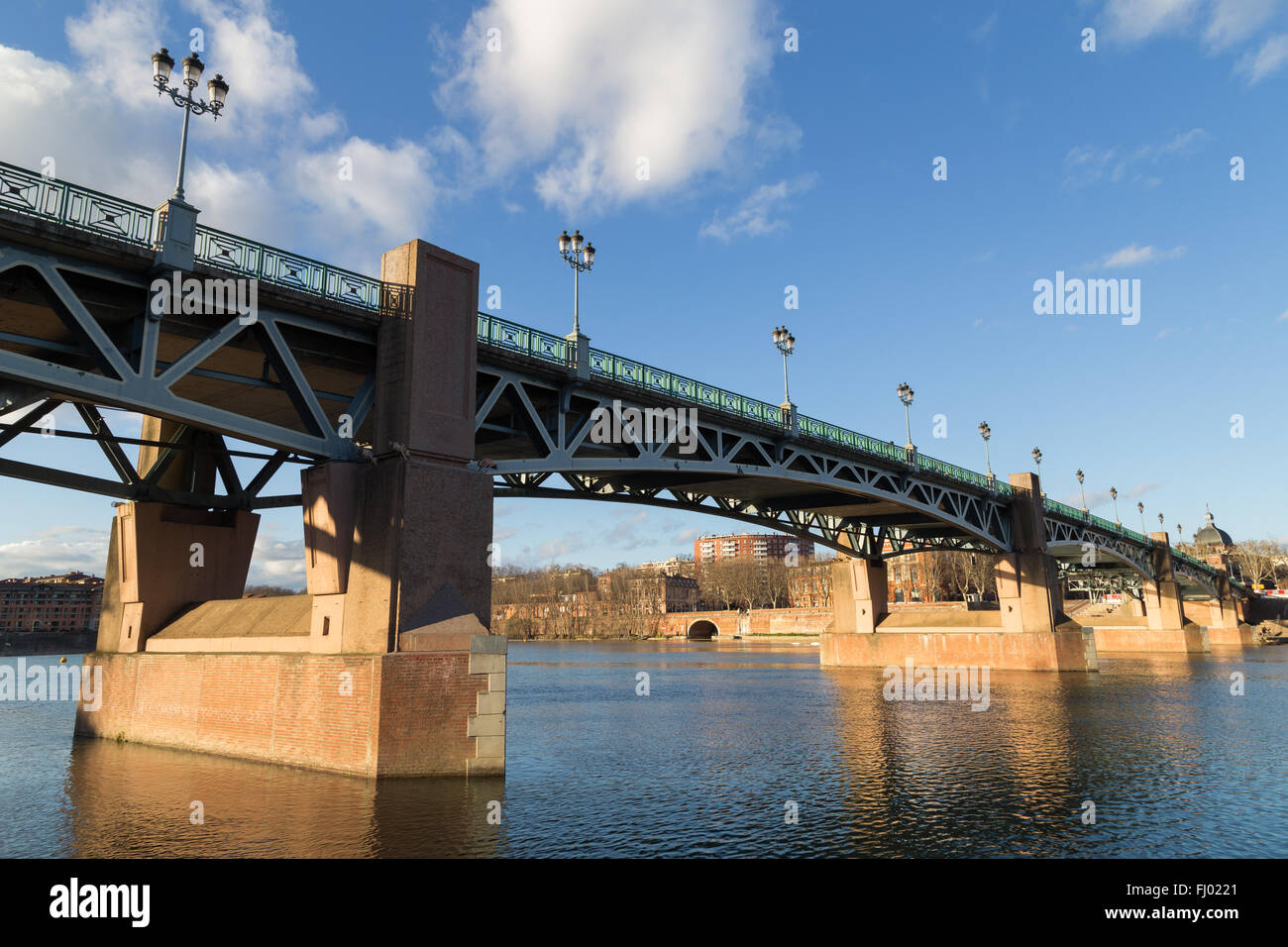 Photograph of the Garonne River and bridge Saint-Pierre in Toulouse, France. Stock Photo