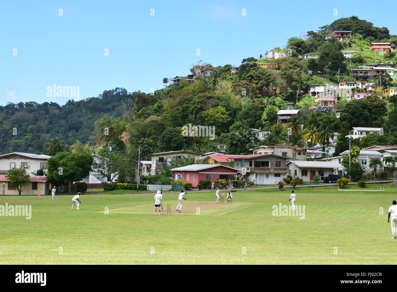 A game of cricket at one of the most picturesque grounds in the world, Charlotteville, Tobago. Stock Photo