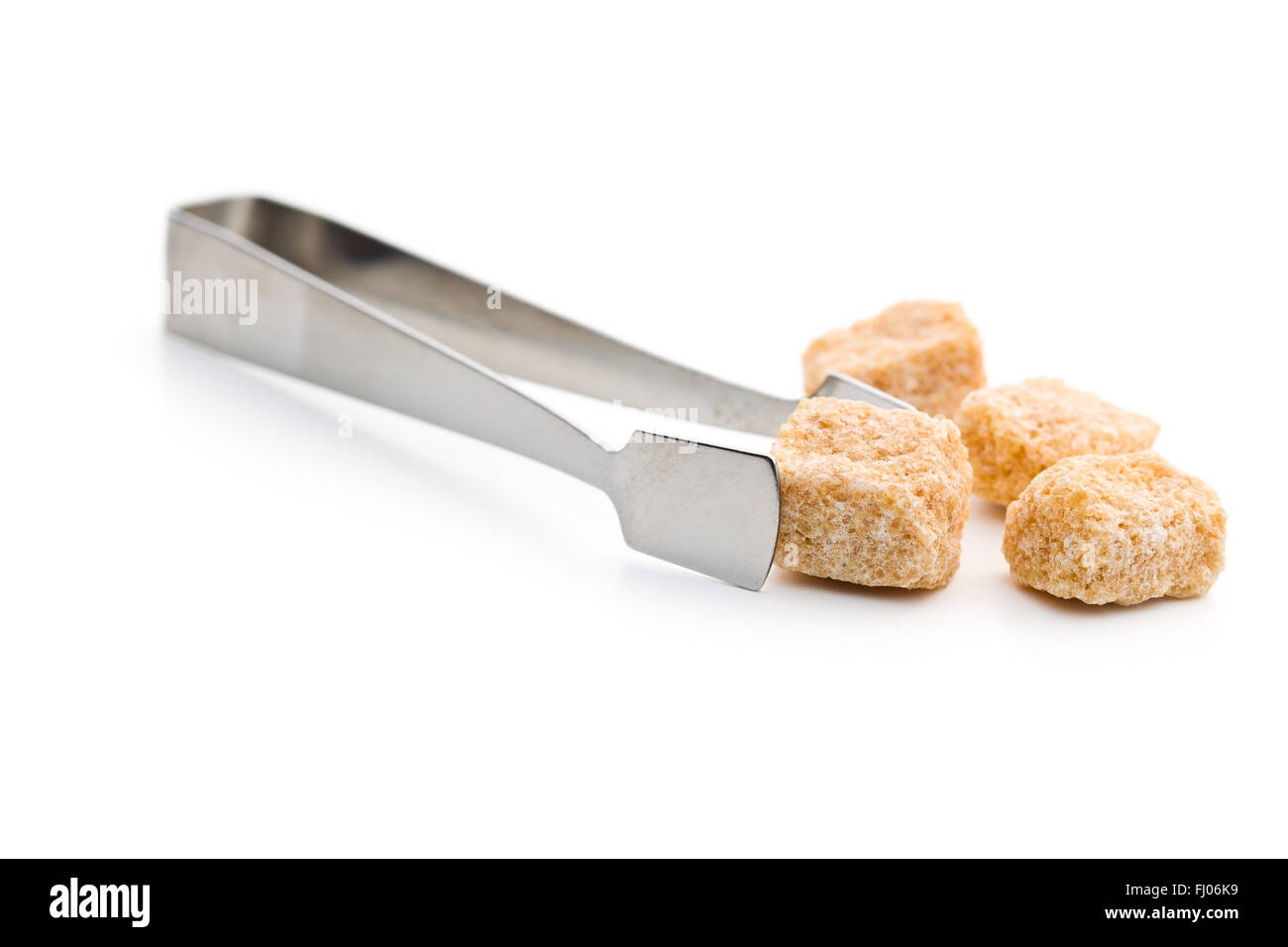 sugar cubes and sugar tongs on white background Stock Photo Alamy