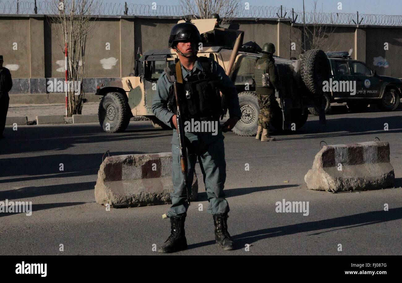 Kabul, Afghanistan. 27th Feb, 2016. An Afghan policeman stands guard near the blast site in Kabul, capital of Afghanistan, Feb. 27, 2016. About nine persons were killed and 13 others wounded after a Taliban suicide bomber struck a military personnel bus in Afghan capital of Kabul on Saturday afternoon, the provincial police chief said. Credit:  Jawid Omid/Xinhua/Alamy Live News Stock Photo