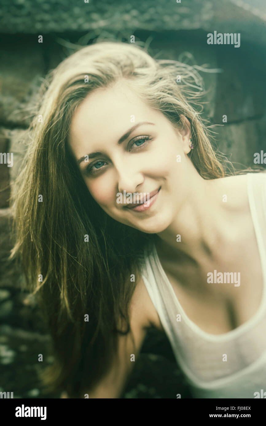 Happy young woman smiling outdoors Stock Photo