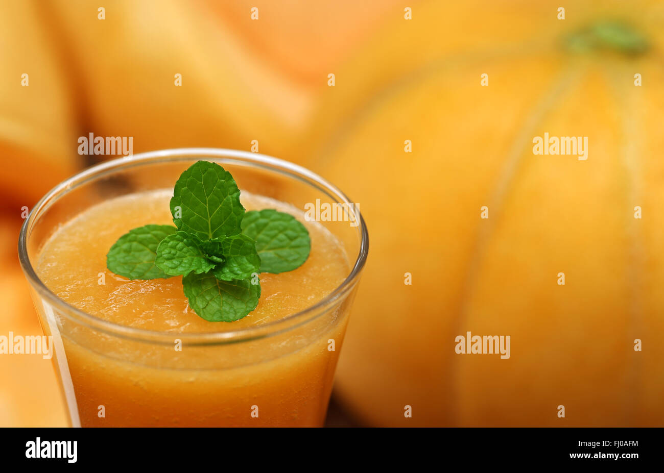 Cucumis Melo or Muskmelon juice with mint leaves Stock Photo