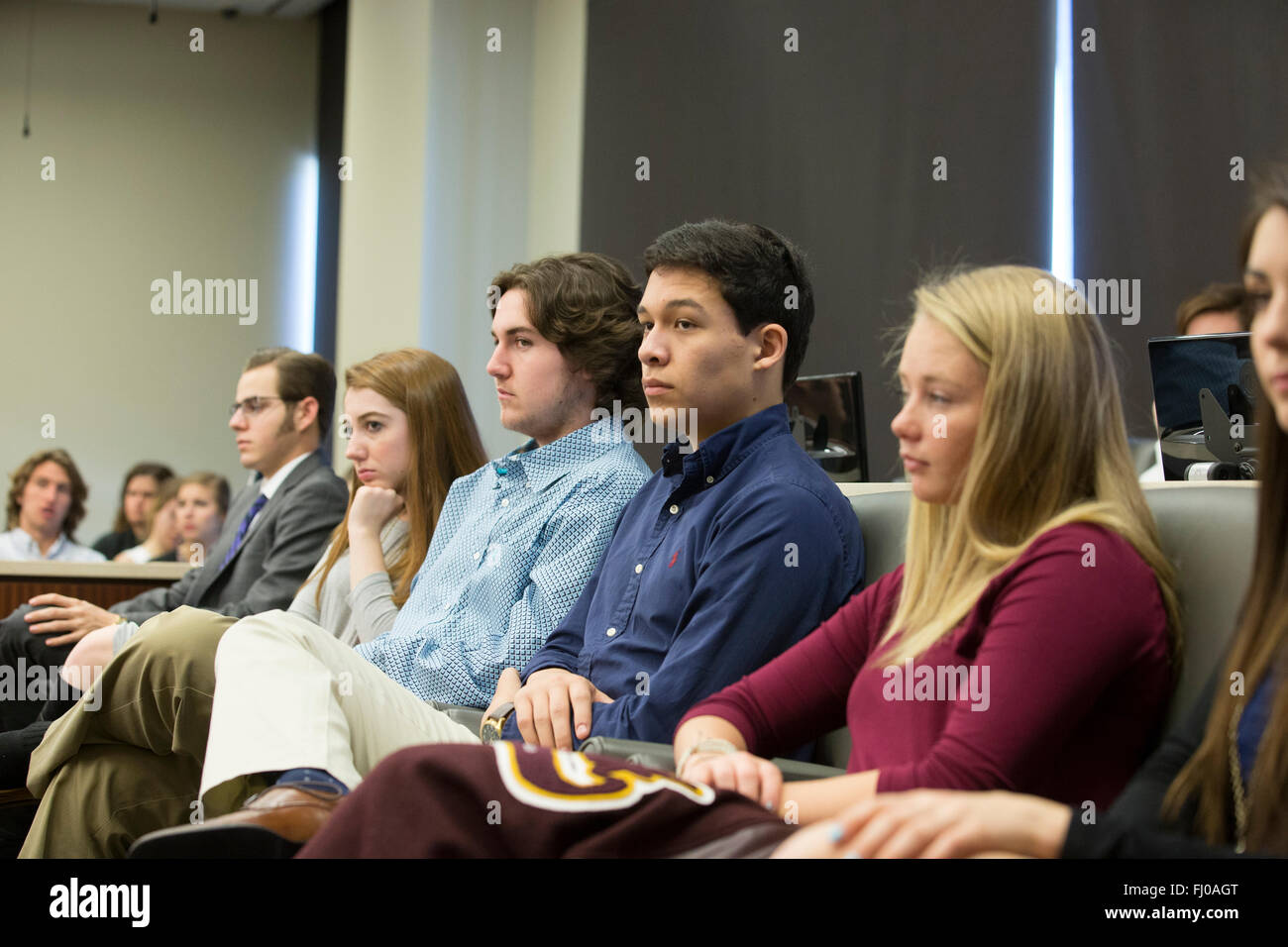 Teens posing as jurors listen to proceedings in county courtroom during mock trial for high school students in Texas Stock Photo