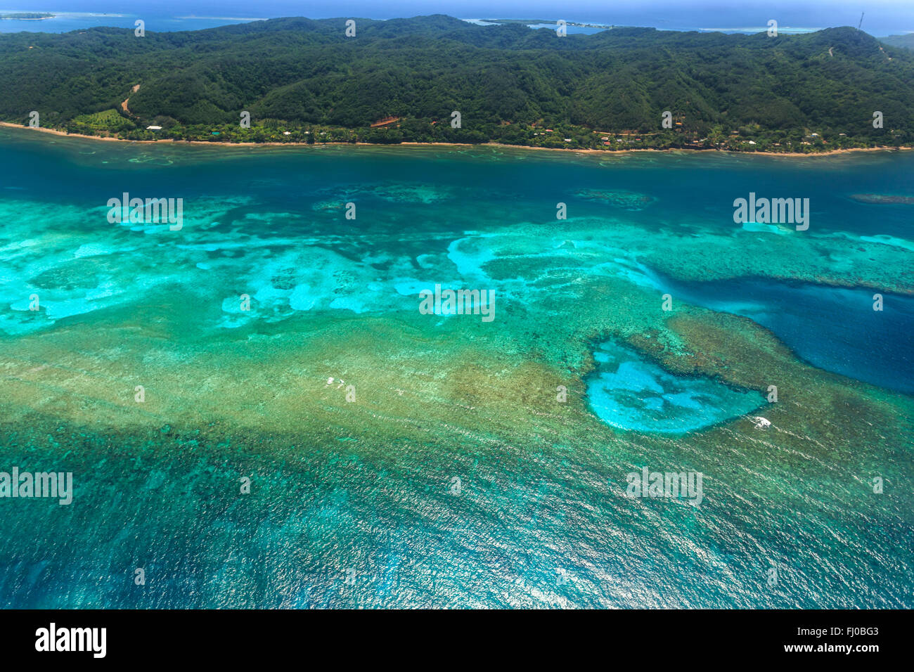 Aerial image of tropical coral reef and island Stock Photo - Alamy