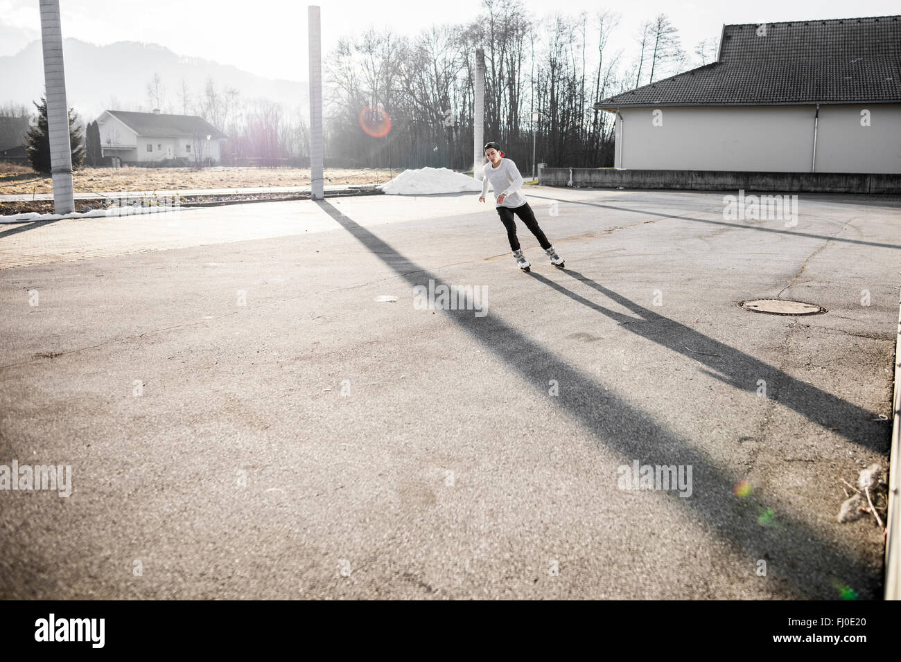 Young man inline skating Stock Photo