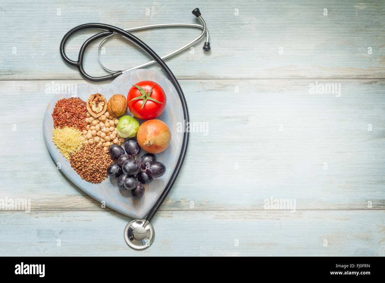 Healthy lifestyle concept with food on heart closeup Stock Photo