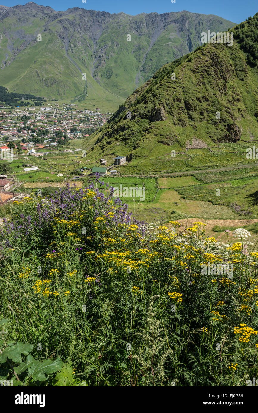 View on Stepantsminda (former Kazbegi) town in Mtskheta-Mtianeti region, Caucasus Mountains, Georgia Stock Photo
