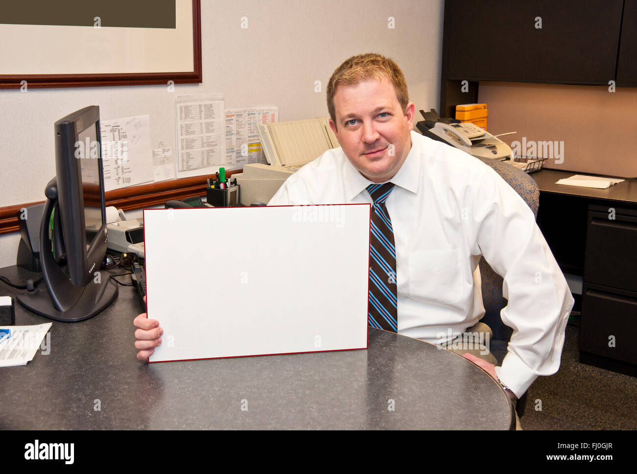 Businessman With Blank Sign Stock Photo