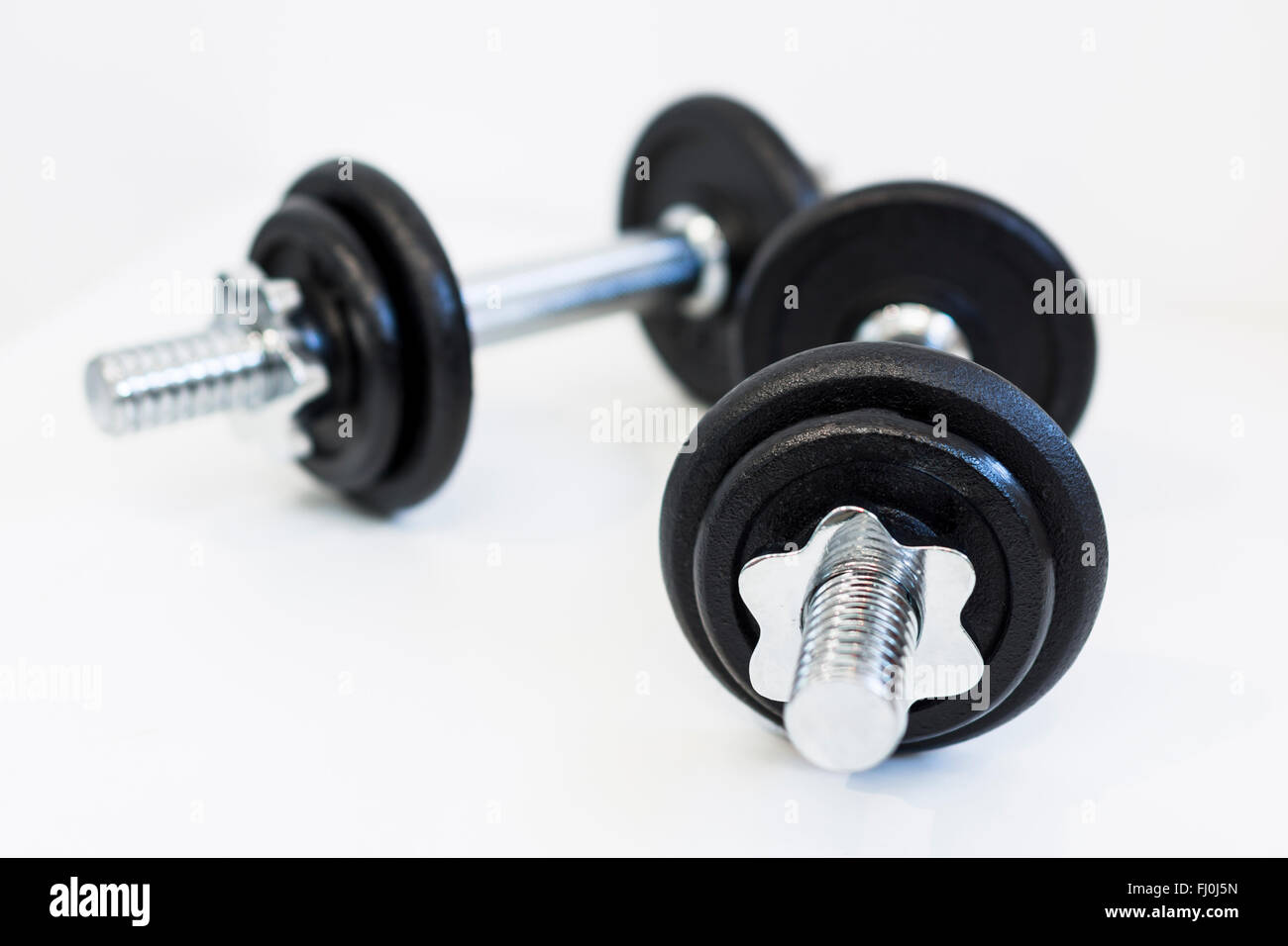 Dumbbells on a white background. Stock Photo