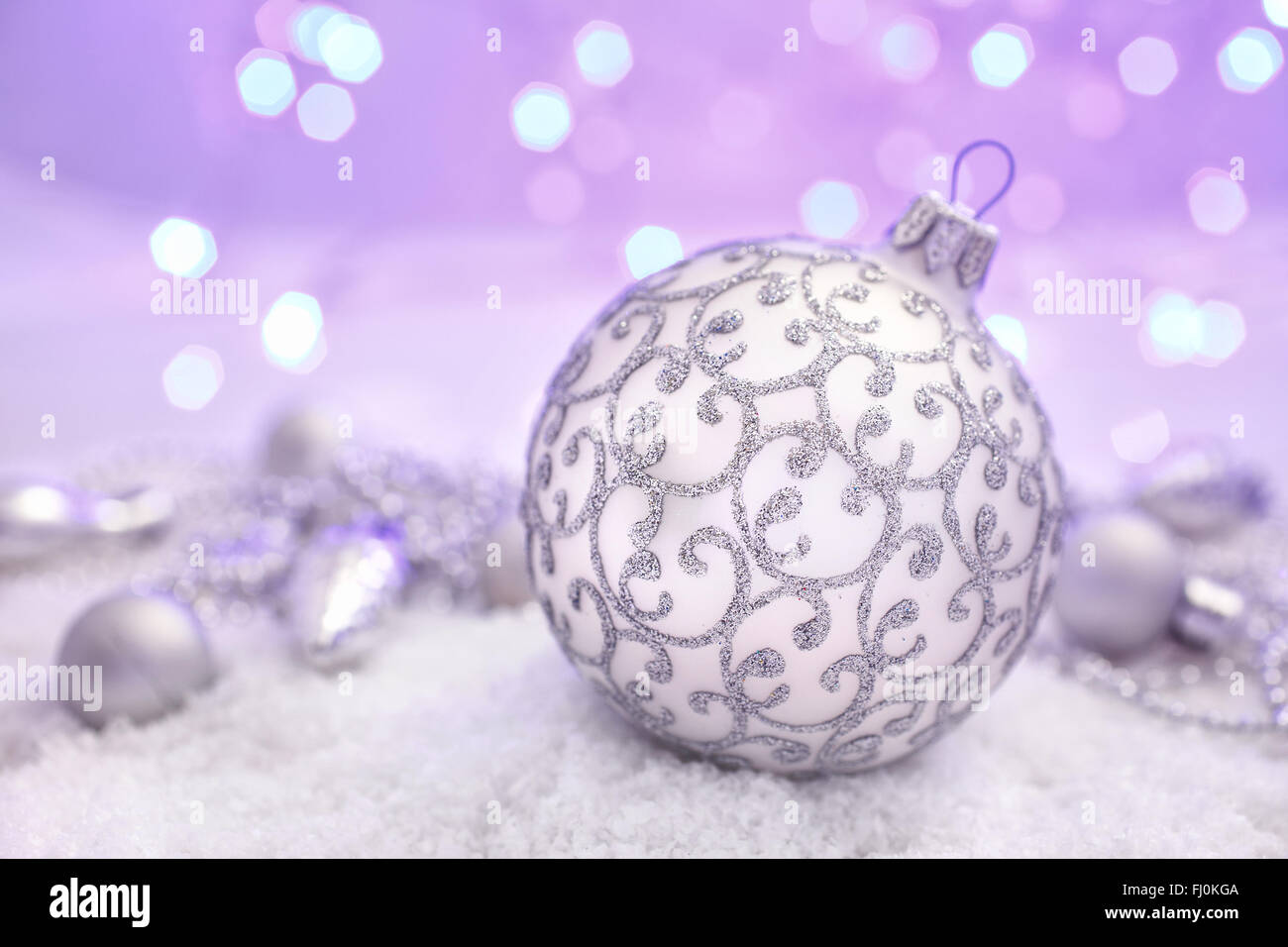 Christmas ball in the snow on abstract background Stock Photo - Alamy