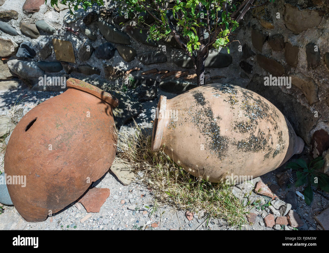 old Kvevri wine vessels in Uplistsikhe (the lord's fortress) ancient rock-hewn town in Georgia, Shida Kartli region Stock Photo